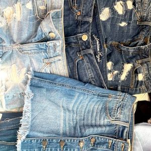 three pairs of jean shorts and denim skirt